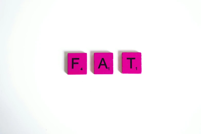 the word fat spelled in scrabbles on a white surface, an album cover, pexels, ((pink)), 3 - piece, fatal, fit physique