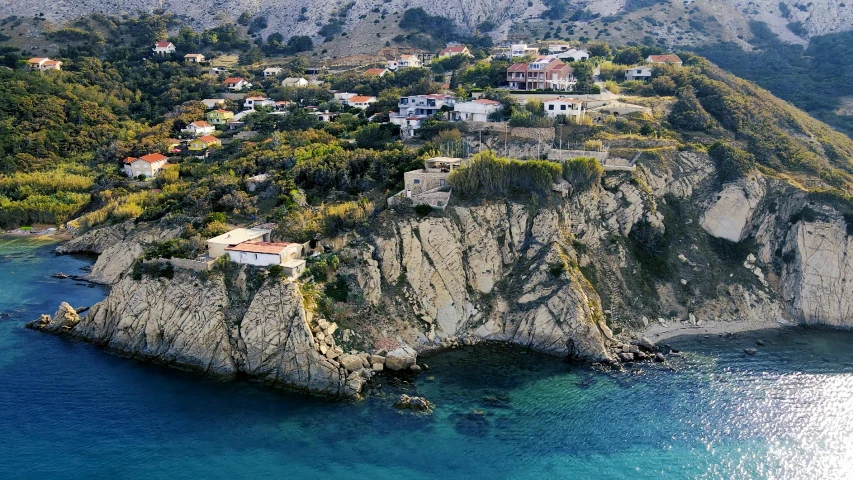 a small island in the middle of a body of water, by Carlo Carrà, pexels contest winner, renaissance, coastal cliffs, alexandros pyromallis, neighborhood, 2000s photo