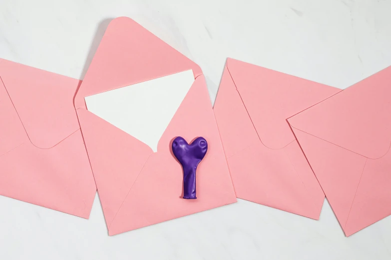 a pair of scissors sitting on top of pink envelopes, inspired by Louise Bourgeois, letterism, inflatable, product introduction photo, magic heart, embossed