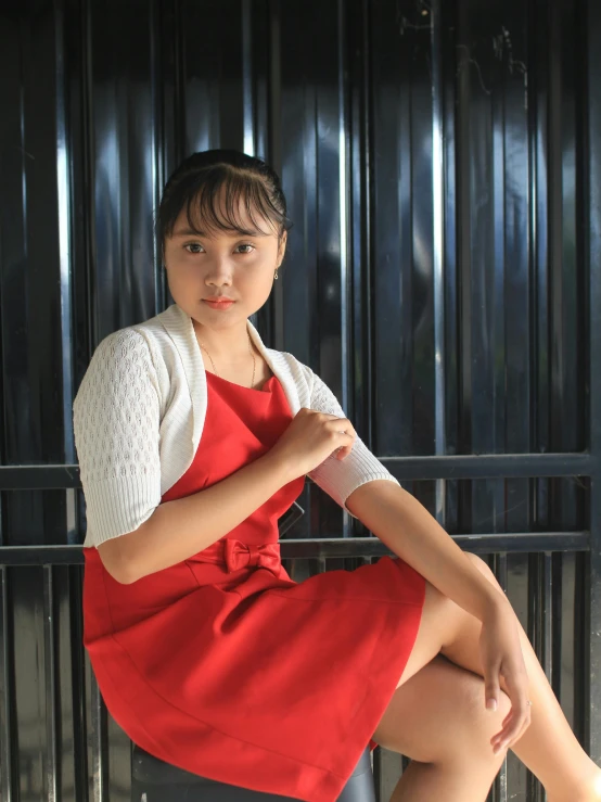 a woman in a red dress sitting on a bench, inspired by Kim Du-ryang, pexels contest winner, dau-al-set, 🤤 girl portrait, wearing white camisole, girl wearing uniform, taken in the late 2010s