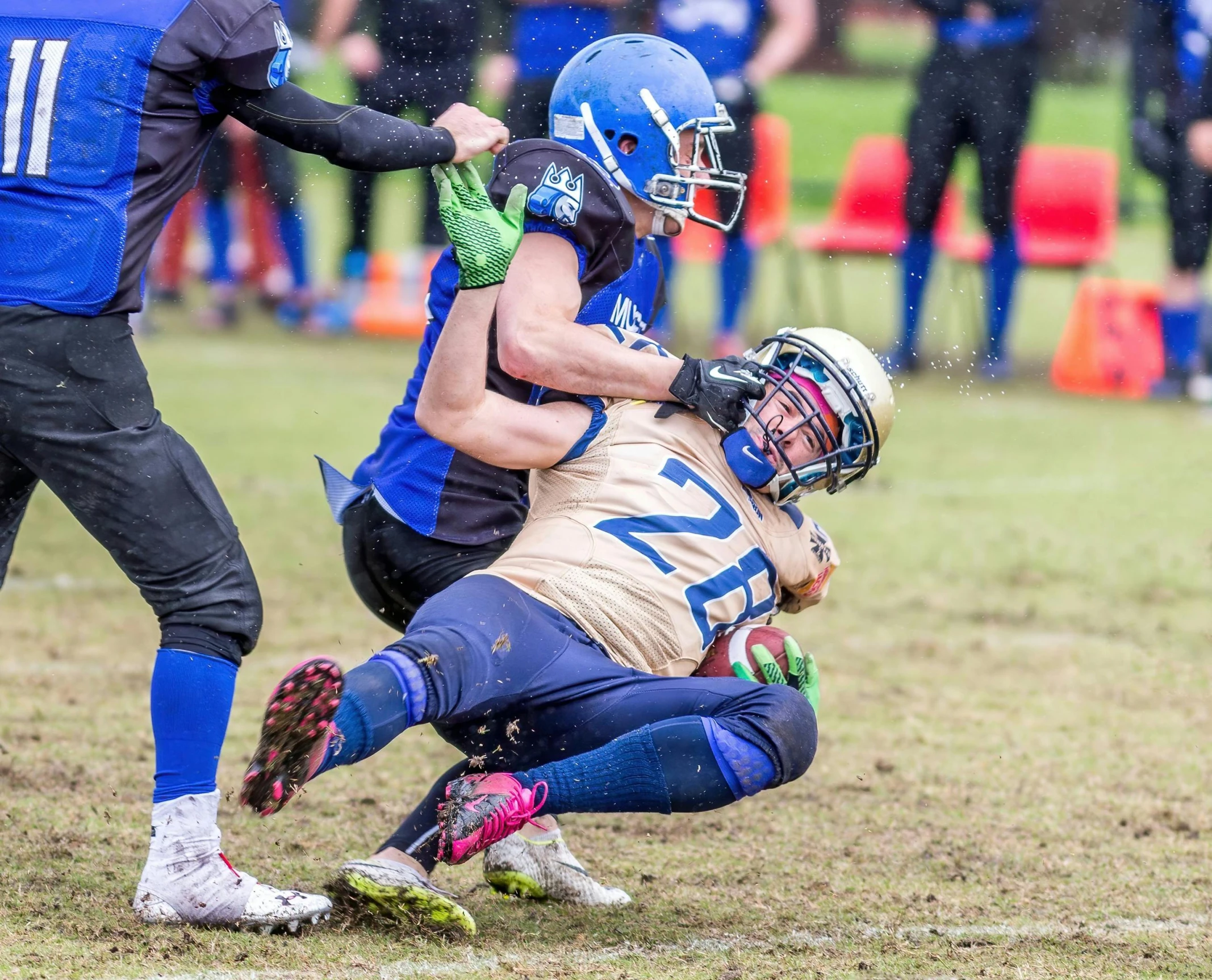 a group of young men playing a game of football, reddit, figuration libre, 8k octan photo, biting lip, helmet, blue