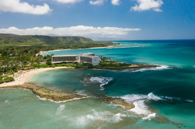 a large building sitting on top of a beach next to the ocean, flatlay, hawaii beach, hotel, jamaica