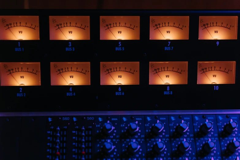 a close up of a bunch of gauges on a wall, an album cover, unsplash, process art, softly glowing control panels, warm studio lighting, blue and orange lighting, thumbnail