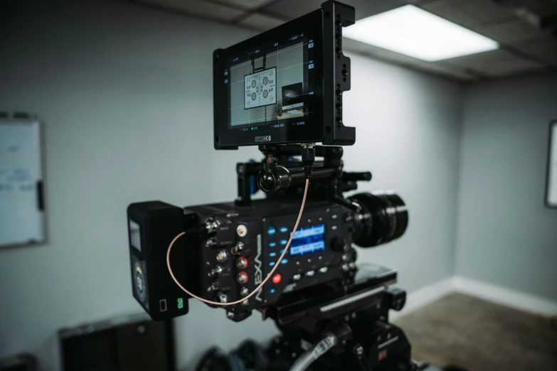 a video camera sitting on top of a tripod, production ig studios, sony a 7 s, dof 8 k, tv footage