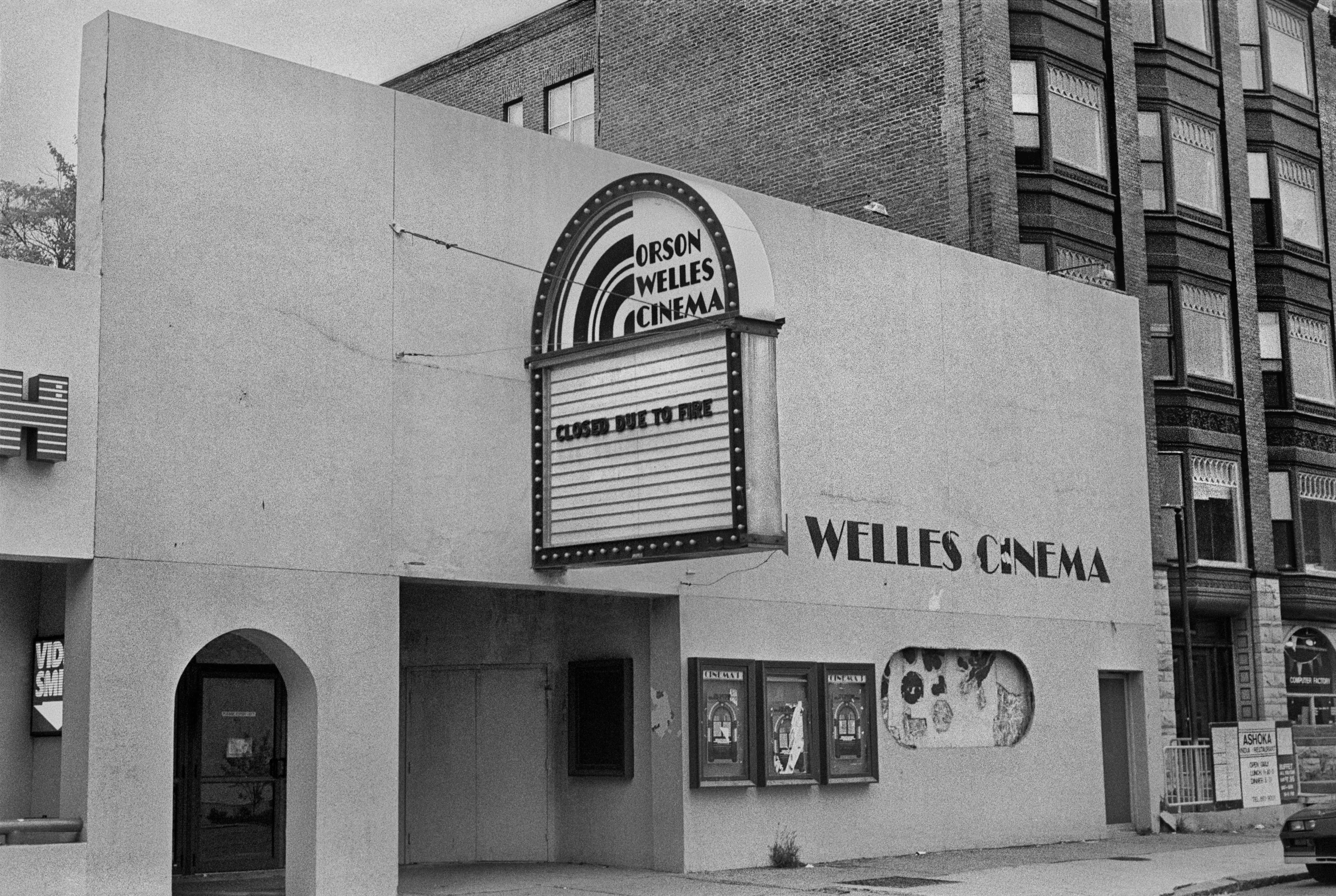 a black and white photo of a movie theater, weta, charles burns, velvia film, well