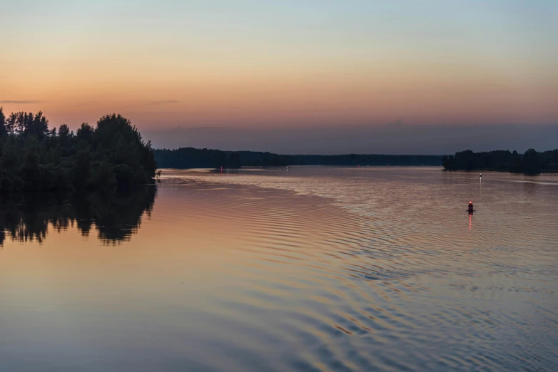 a body of water with trees in the background, by Jan Tengnagel, pexels contest winner, romanticism, sunset panorama, great river, rutkowskyi, zoomed in