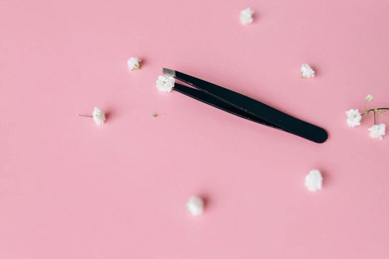 a pair of tweezers sitting on top of a pink surface, trending on pexels, gypsophila, black heavy eyeliner, animation, thinning hair