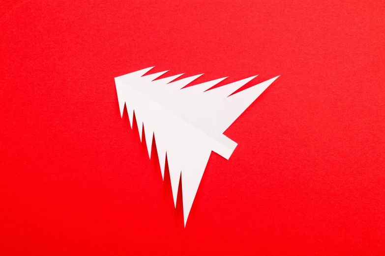 a paper christmas tree on a red background, by Andrew Allan, arrow shaped, aircraft, behance lemanoosh, album cover