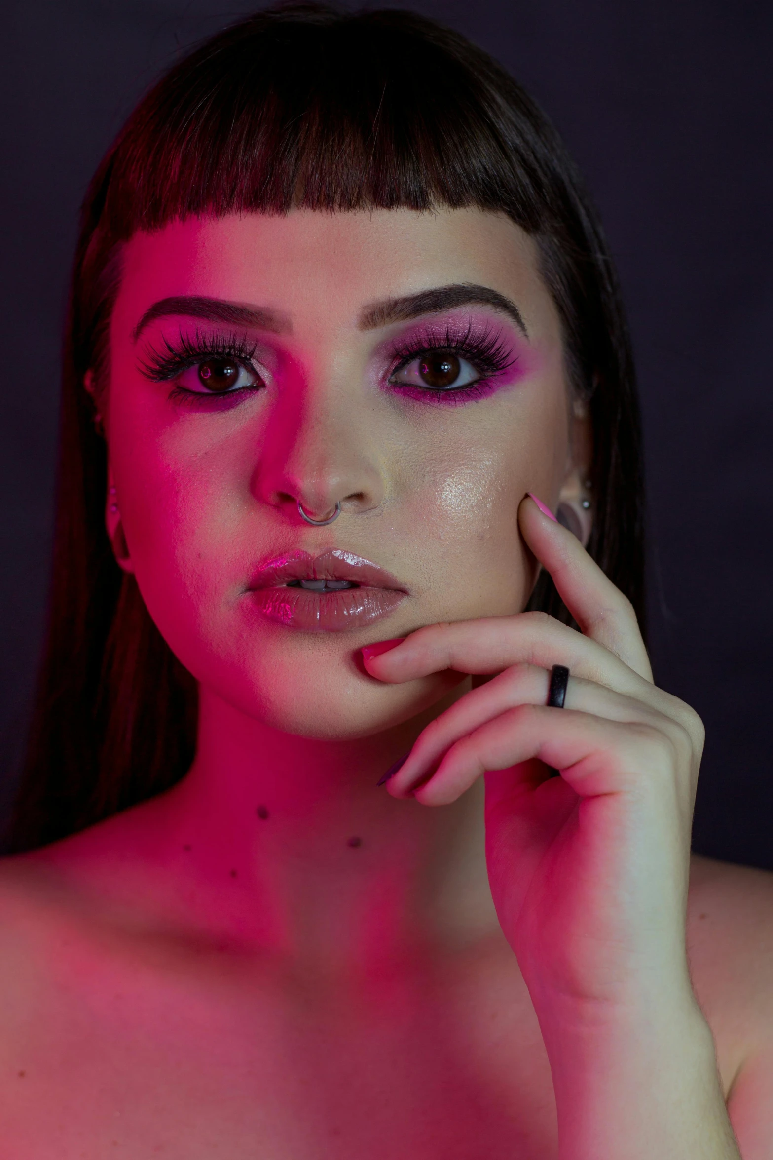 a woman with pink makeup posing for a picture, an album cover, inspired by Elsa Bleda, trending on pexels, holography, charli xcx, dramatic lowkey studio lighting, low quality photo, red lights