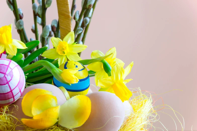 a vase filled with easter eggs and daffodils, trending on pixabay, 🐿🍸🍋, full product shot, warm coloured, thumbnail