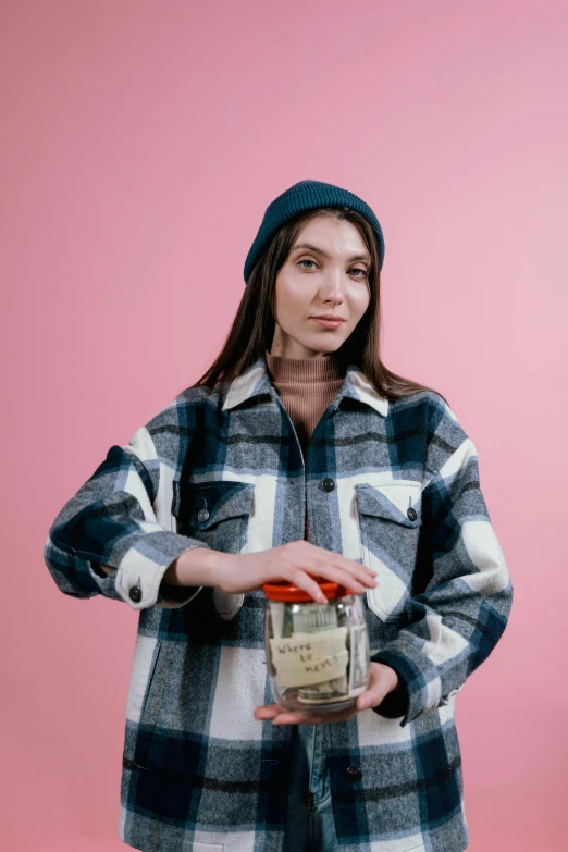 a woman in a plaid shirt holding a jar, by Julia Pishtar, trending on pexels, maximalism, portrait sophie mudd, gif, promotional image, wearing farm clothes