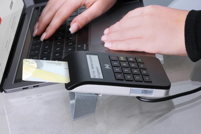 a close up of a person typing on a laptop, private press, cash register, cyberdeck computer terminal, handheld, julia hetta