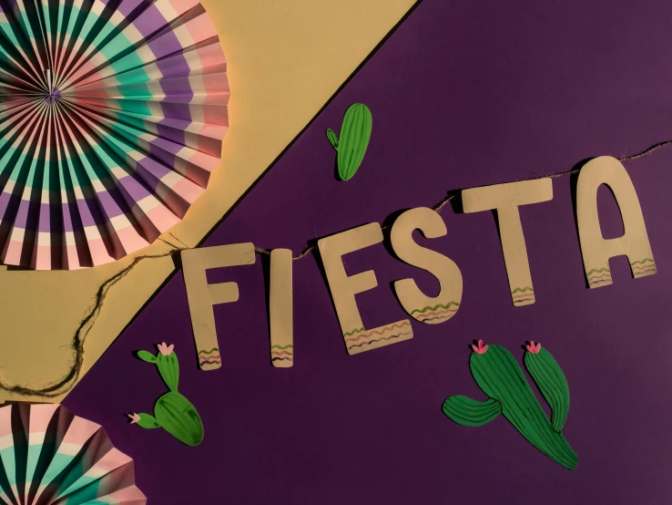 a bunch of paper fans sitting on top of a table, an album cover, trending on pexels, mexican desert, background image, flowing lettering, violet colored theme