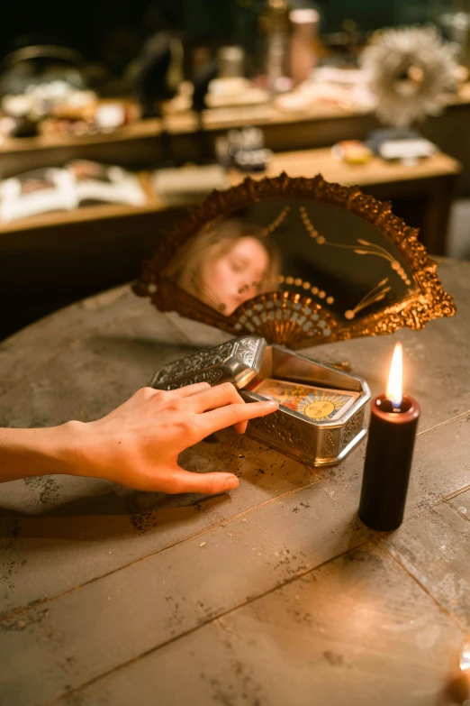 a person lighting a candle on a table, antique perfume, an escape room in a small, black, ritual