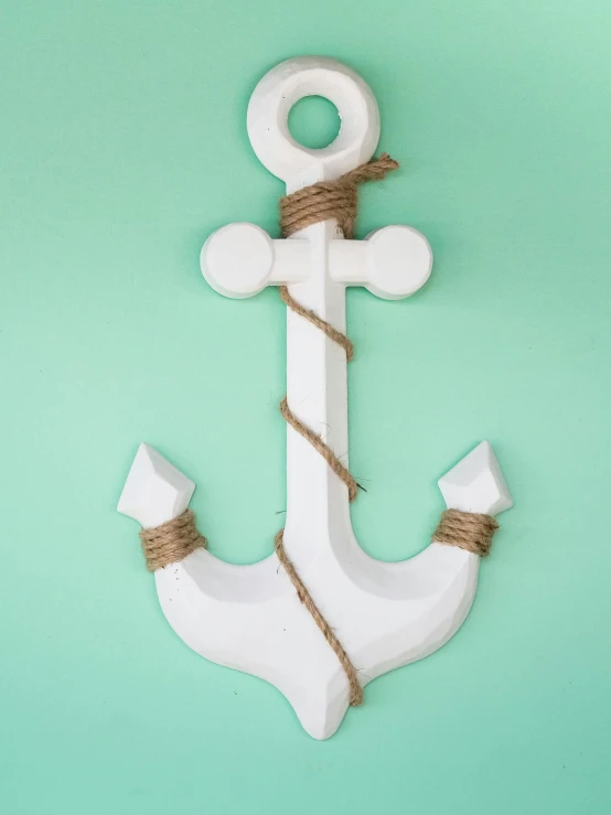 a white anchor sitting on top of a green wall, inspired by Paul Howard Manship, unsplash, new sculpture, white background”, made of wood, glossy white, made out of plastic