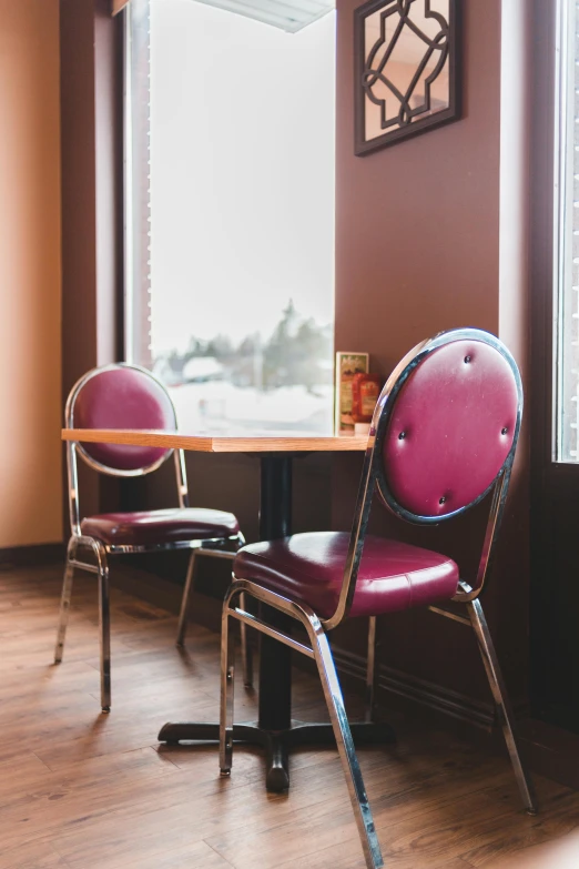 a couple of chairs sitting in front of a window, by Sven Erixson, unsplash, fargo, diner caffee, brown and magenta color scheme, 15081959 21121991 01012000 4k