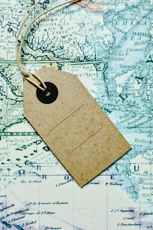 a close up of a tag on a map, vintage shapes, extra wide, lightweight, on island