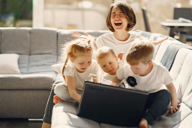 a woman sitting on a couch with two children and a laptop, pexels contest winner, excited russians, avatar image, thumbnail, high quality image