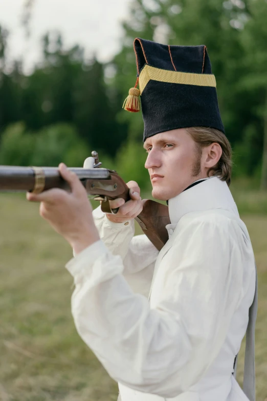 a man in a military uniform holding a rifle, inspired by Horace Vernet, unsplash, renaissance, live-action archival footage, young tsar, white, the texas revolution