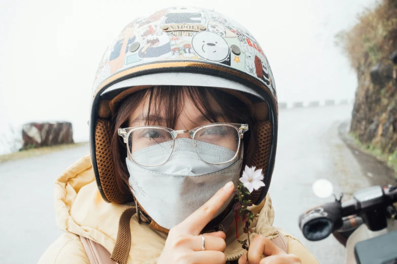 a woman wearing a face mask and holding a flower, trending on unsplash, motorcycle helmet, wearing square glasses, avatar image, wearing dirty travelling clothes