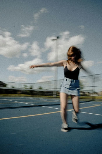 a woman standing on top of a tennis court holding a racquet, an album cover, unsplash, photorealism, skater skirt, girl is running, slow shutter speed, looks a blend of grimes