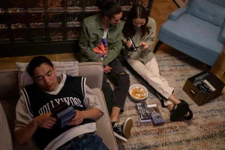 a group of people sitting on top of a couch, inspired by Liam Wong, pexels contest winner, hyperrealism, playing games, still from alita, snacks, goodnight