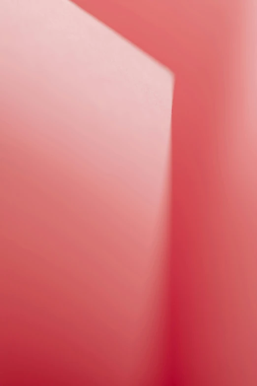 a white toilet sitting in a bathroom next to a red wall, a picture, by Doug Ohlson, conceptual art, gradient pink, zoomed in, issey miyake, blurred