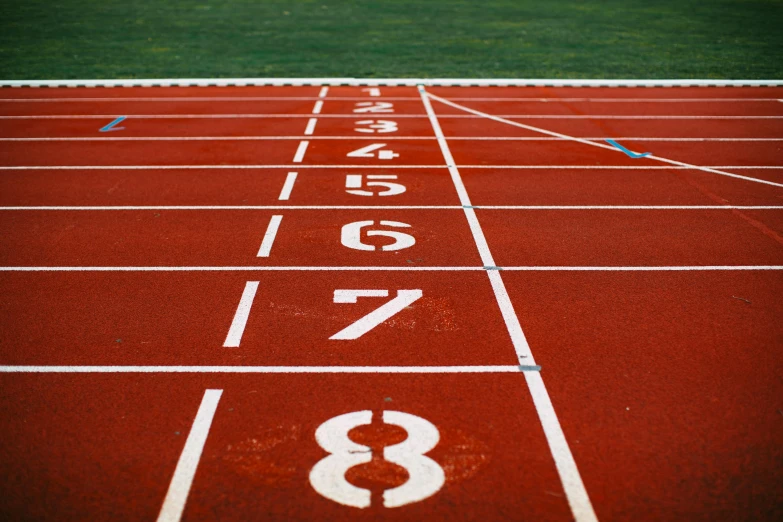 a close up of a track with numbers on it, by Anna Findlay, pexels contest winner, victory lap, profile image, large format, on ground