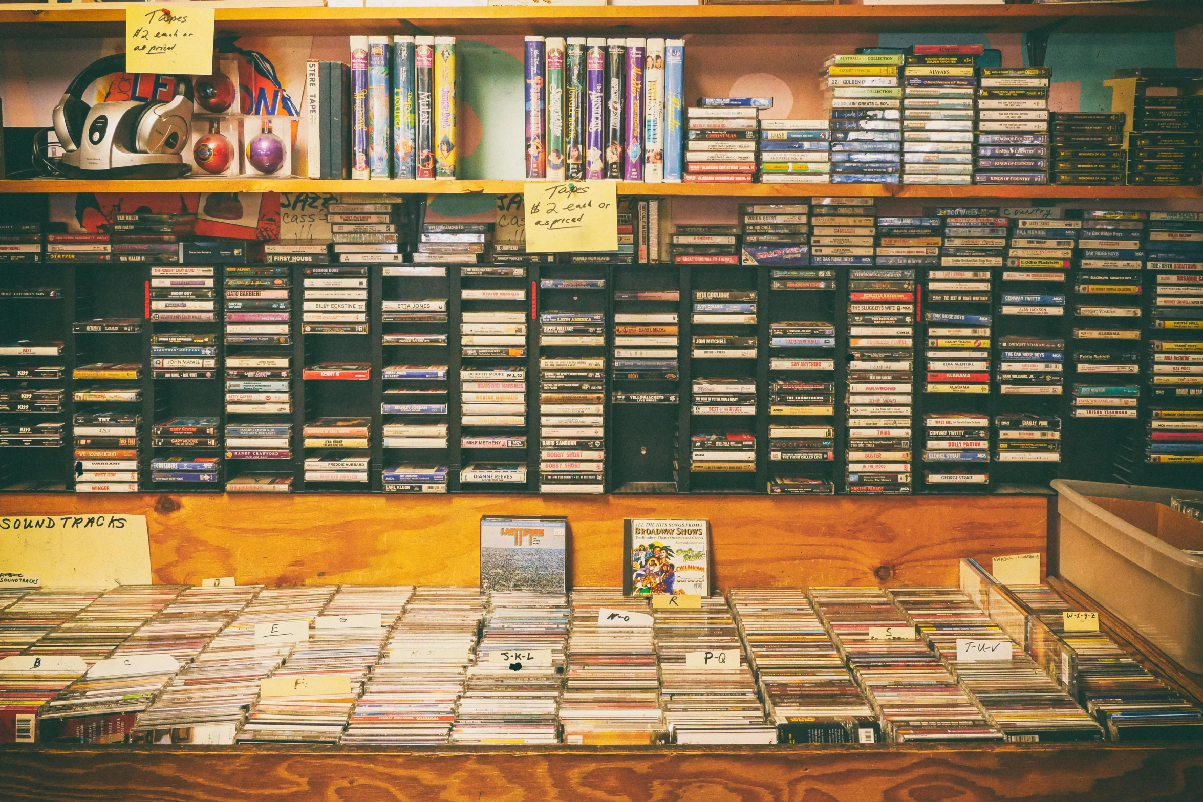 a room filled with lots of cds and cds, an album cover, by Joe Bowler, 1990s photograph, adult video store, portra, 2 0 0 0's photo