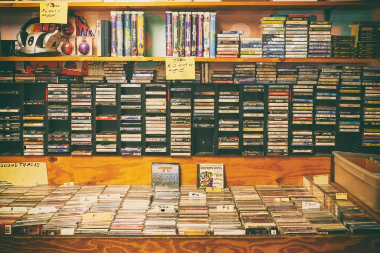 a room filled with lots of cds and cds, an album cover, by Joe Bowler, 1990s photograph, adult video store, portra, 2 0 0 0's photo