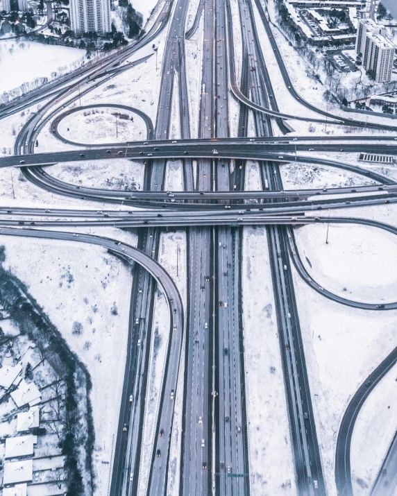 an aerial view of a snow covered highway, an album cover, unsplash contest winner, graffiti, complex structures, thumbnail, multiple stories, hyper complexity