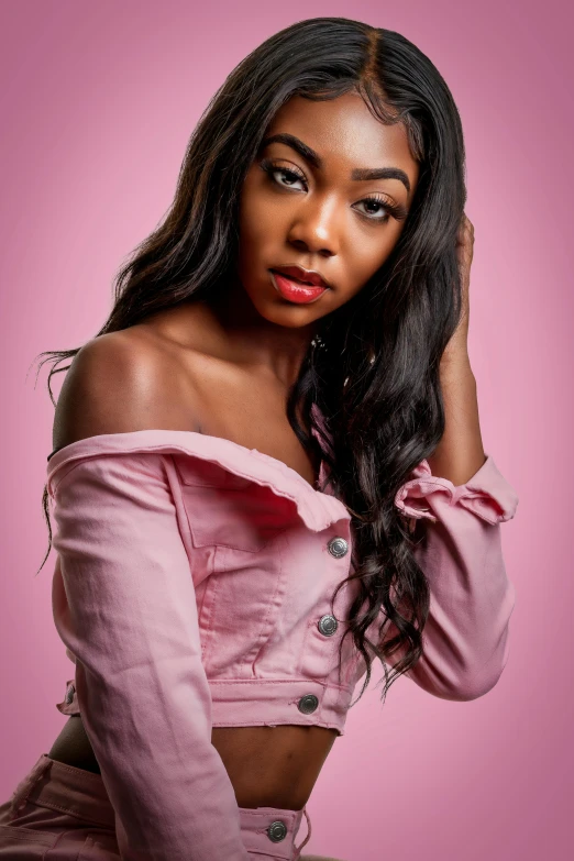 a beautiful young woman posing on a pink background, inspired by Sophia Beale, trending on pexels, ( ( dark skin ) ), photoshoot poses, closeup!!!!!!, dressed in a pink dress