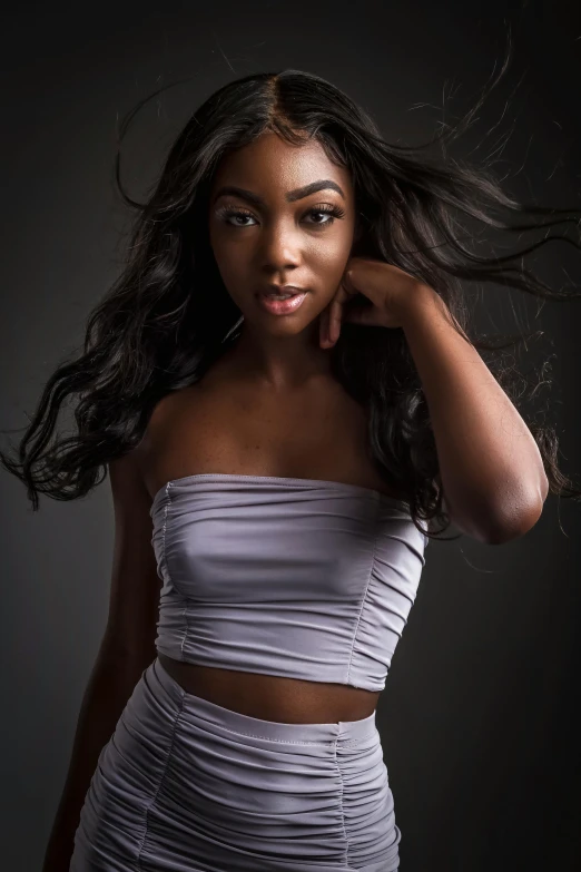 a woman in a white dress posing for a picture, deep black skin, wearing a crop top, 1 / 4 headshot, flowing hair