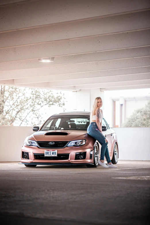 a woman sitting on the hood of a car, inspired by Sydney Carline, brushed rose gold car paint, wrx golf, deep dish wheels, not cropped