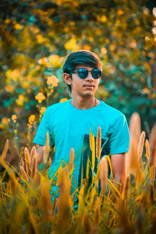 a young man standing in a field of tall grass, a picture, by Max Dauthendey, pexels contest winner, color field, with sunglass, avatar image, male teenager, nivanh chanthara