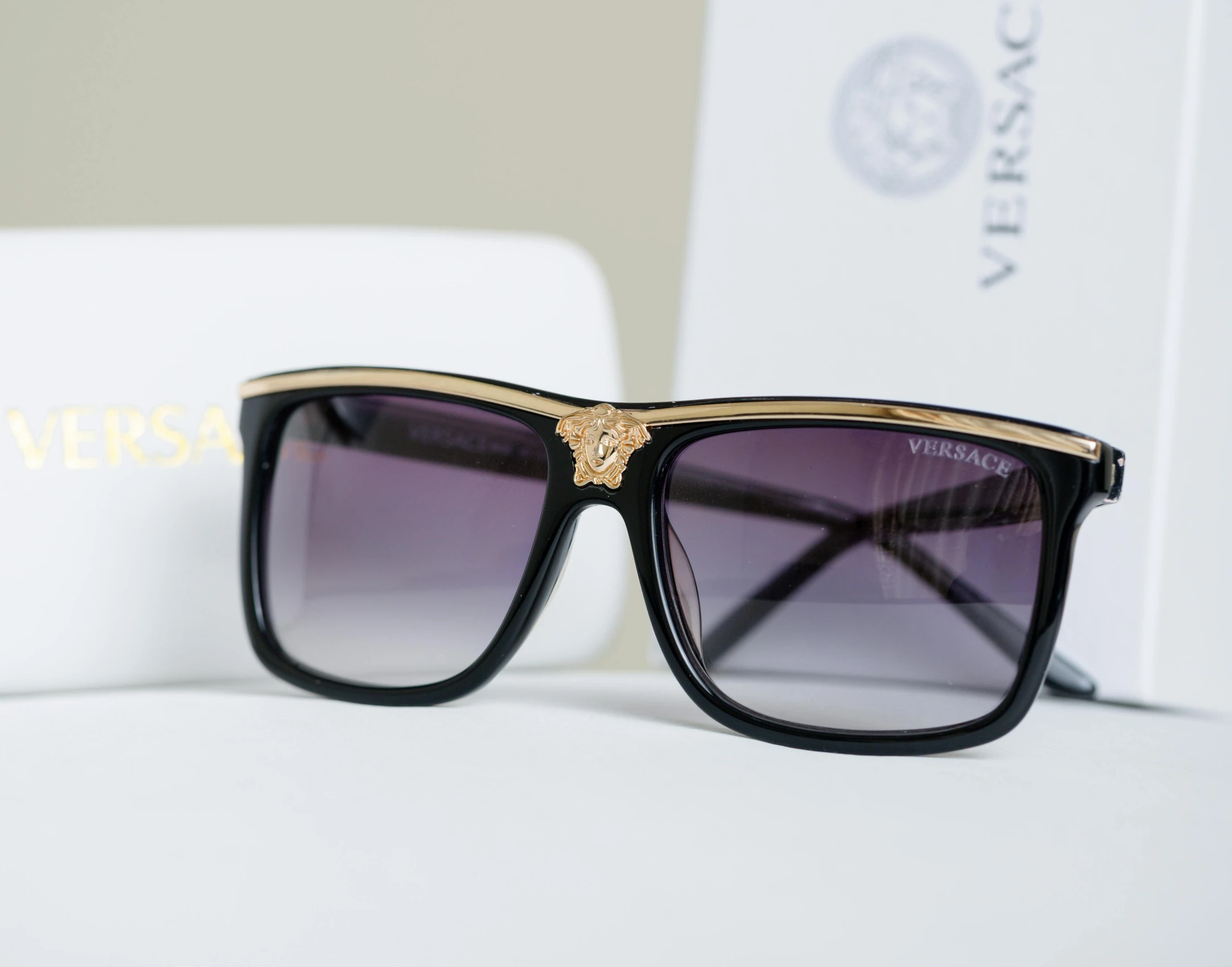 a pair of sunglasses sitting on top of a table, a picture, versace, thumbnail, high quality product image”, detailed photograph high quality