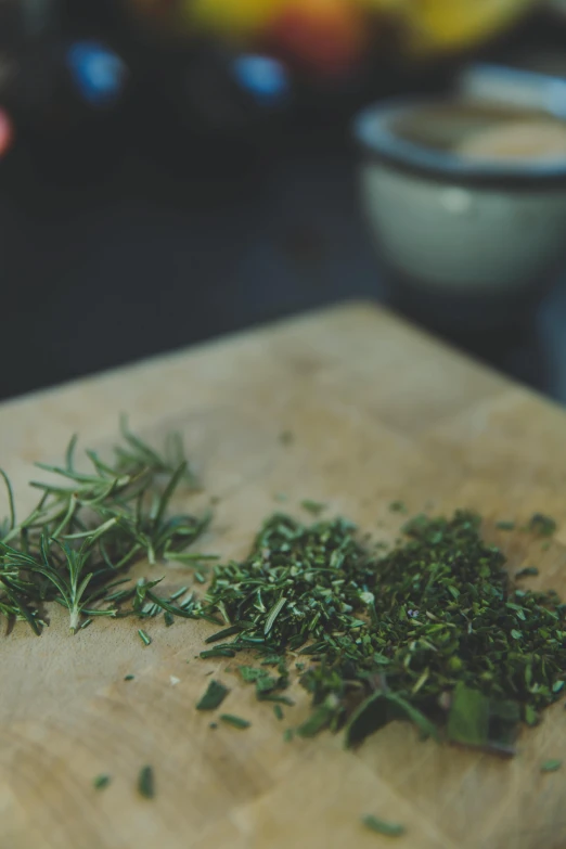 a cutting board with a bunch of herbs on it, by Jessie Algie, trending on unsplash, renaissance, grainy footage, made of glazed, half image