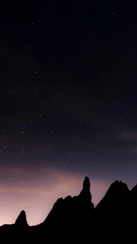 a person standing on top of a mountain under a night sky, pexels contest winner, minimalism, monoliths, low quality photo