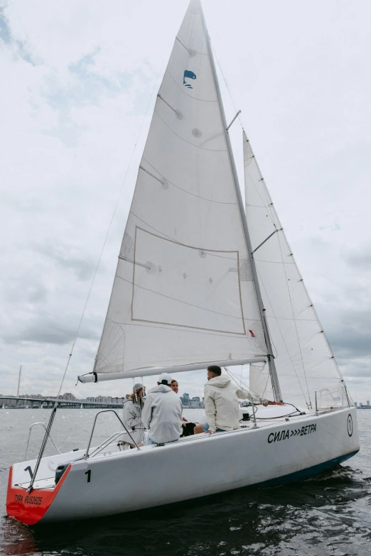 a group of people riding on the back of a sailboat, by Carlo Martini, unsplash, gutai group, side front view, new york harbour, white sky, calmly conversing 8k