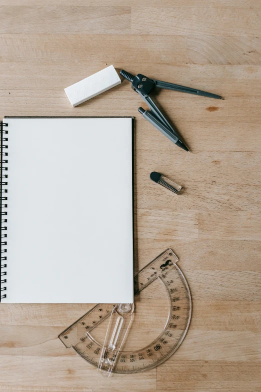 an open notebook sitting on top of a wooden table, by Daniel Seghers, pexels contest winner, academic art, tools, white space, playful composition canon, full-body