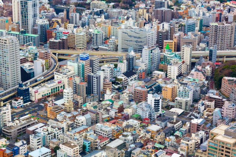 a large city filled with lots of tall buildings, by Hiroshi Honda, pexels contest winner, hyperrealism, japanese rural town, aerial, colorful architecture, dezeen