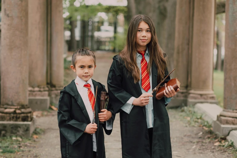 a couple of kids standing next to each other, inspired by Hermione Hammond, unsplash, heidelberg school, realistic cosplay, instagram picture, sienna, 2019 trending photo