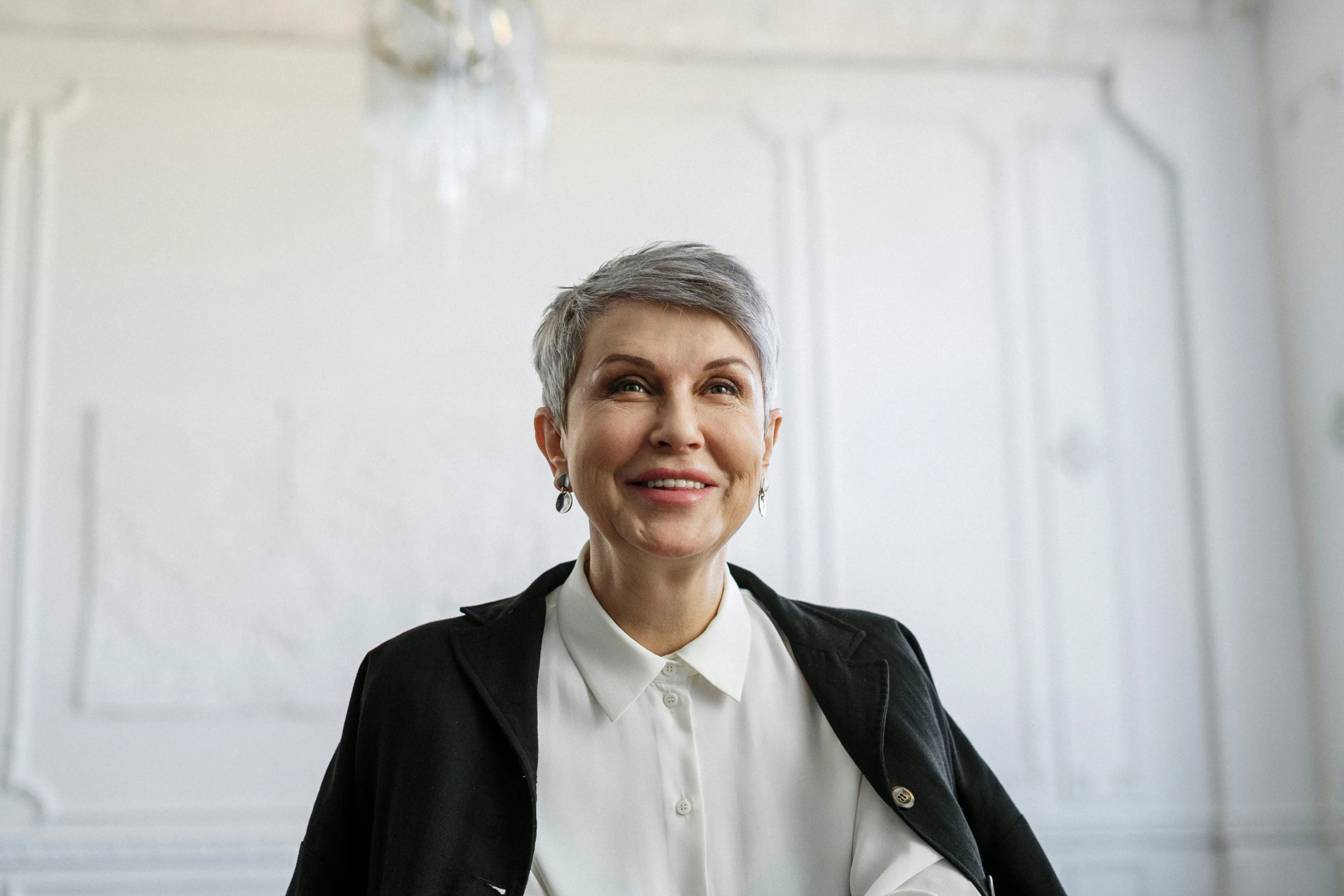 a woman in a white shirt and black jacket, pexels contest winner, short grey hair, nadezhda tikhomirova, ceo, valeriy vegera