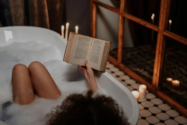 a woman laying in a bathtub reading a book, trending on pexels, renaissance, casting a protection spell, reading for a party, wet hairy bodies, end of the day