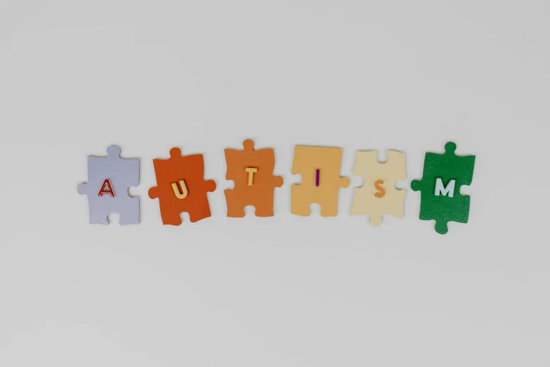 the word autism spelled in puzzle pieces, trending on pexels, antipodeans, 3d asset, muted colours 8 k, autumnal, children's