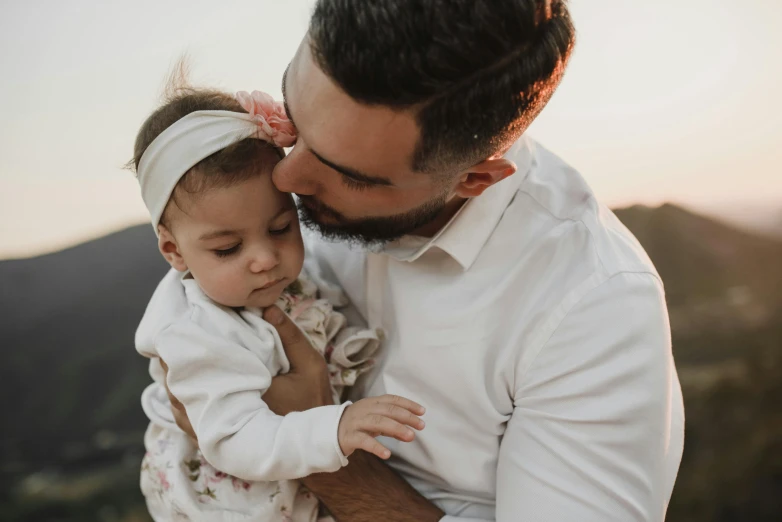 a man holding a little girl in his arms, pexels contest winner, beard stubble, profile image, 1 2 9 7, avatar image