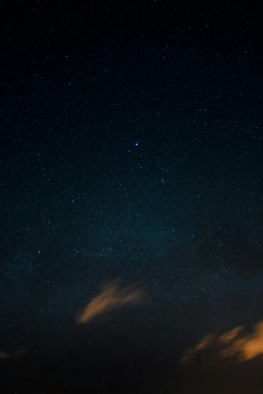 a night sky filled with stars and clouds, a picture, unsplash, cinematic shot ar 9:16 -n 6 -g, imagistic sky, low quality photo