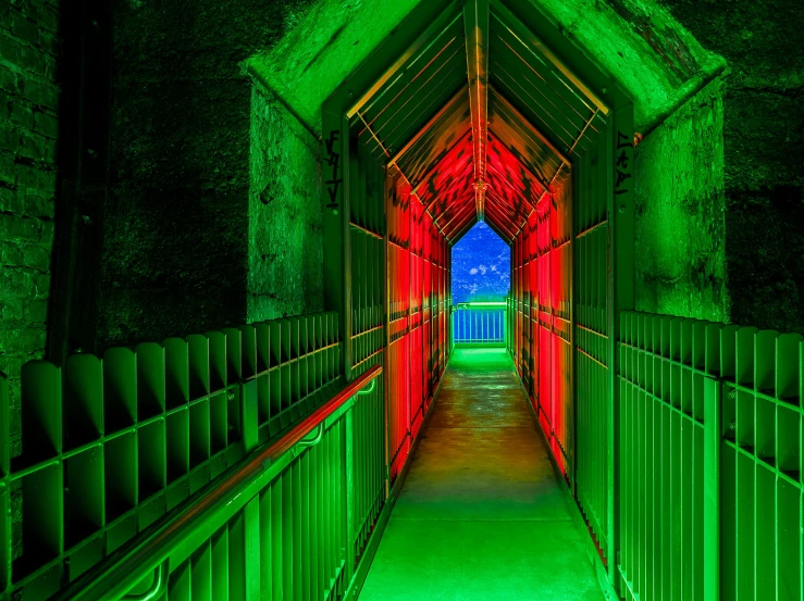 a green and red light at the end of a tunnel, inspired by Joseph Wright of Derby, nuclear art, colorful architecture, multi - coloured, gothic lighting, a green