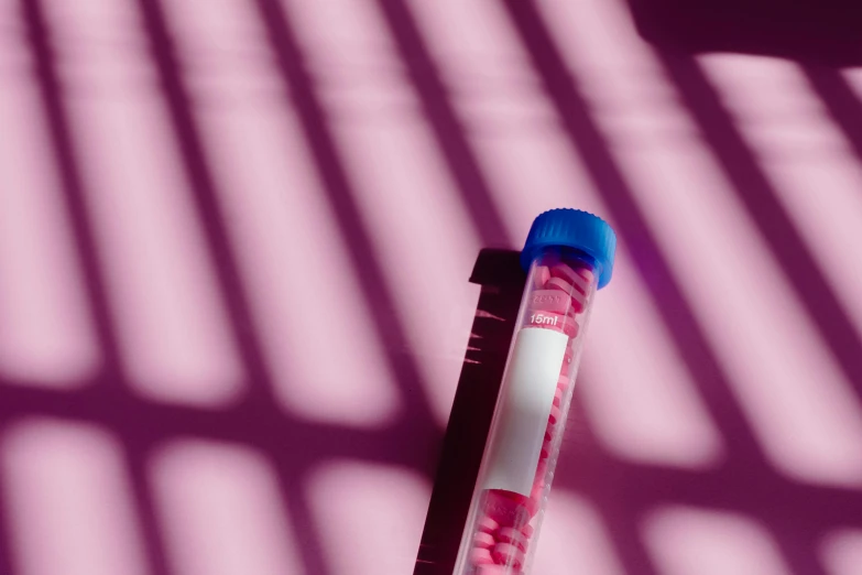 a tube of blood sitting on top of a table, a digital rendering, by Évariste Vital Luminais, unsplash, shades of pink and blue, genetic, medical research facility, magenta colours