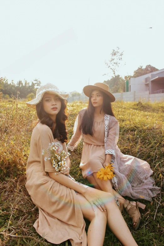 two women sitting next to each other in a field, a picture, by Tan Ting-pho, aestheticism, casual clothing style, high quality upload, pastel style, cinematic outfit photo